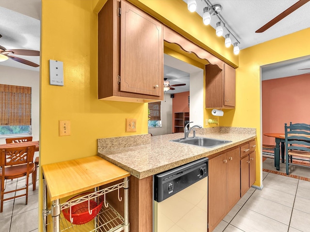 kitchen featuring dishwasher, track lighting, ceiling fan, and light tile floors