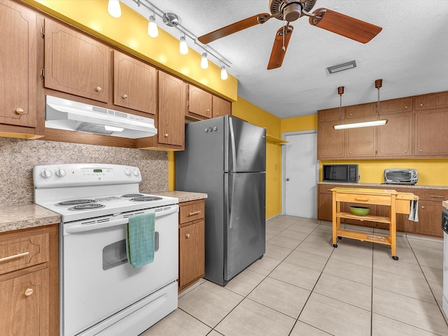 kitchen featuring ceiling fan, stainless steel fridge, white range with electric stovetop, a textured ceiling, and track lighting