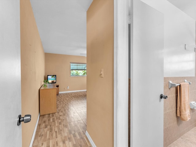 hall with light hardwood / wood-style floors