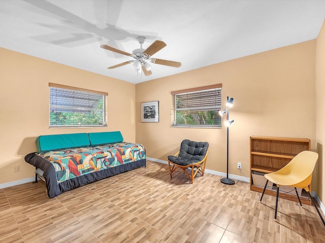 bedroom with multiple windows and ceiling fan