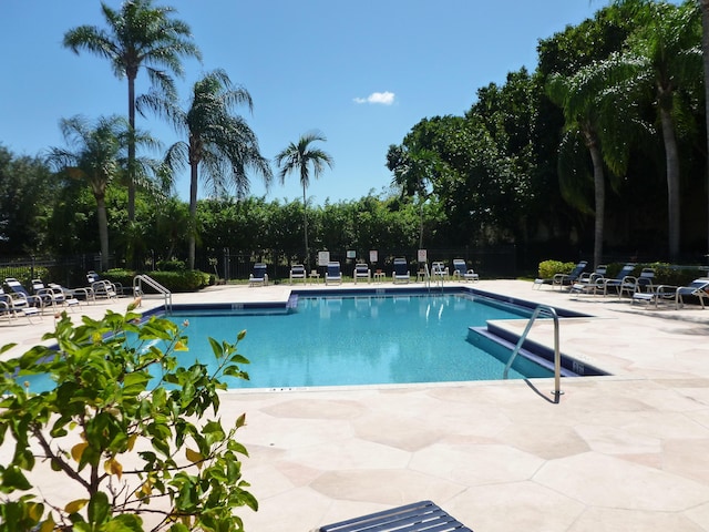 view of swimming pool featuring a patio