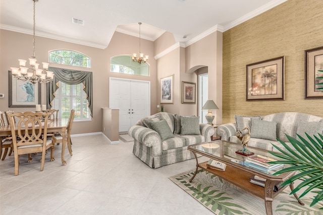 living room featuring a towering ceiling, ornamental molding, a chandelier, and light tile patterned floors