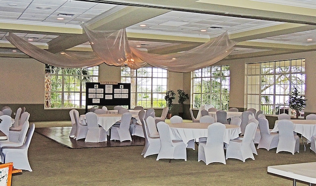 dining space with a wealth of natural light and a notable chandelier