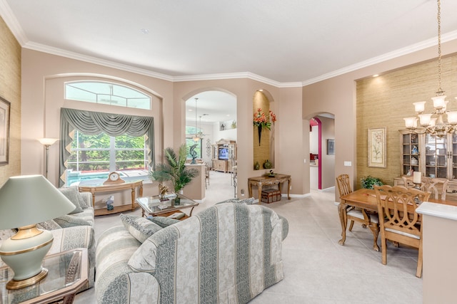 living room with tile patterned floors, an inviting chandelier, and crown molding