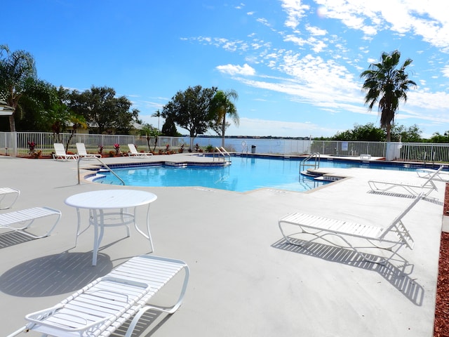 view of swimming pool with a patio area