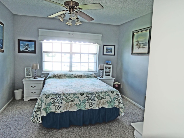 bedroom featuring carpet, a textured ceiling, and ceiling fan