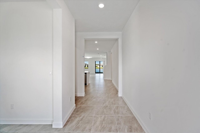 hallway with light tile patterned flooring