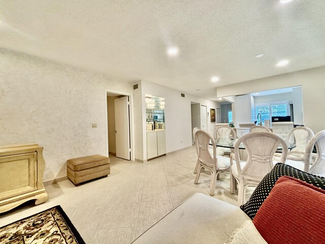 living room featuring a textured ceiling