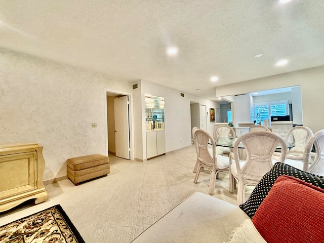 living room featuring a textured ceiling