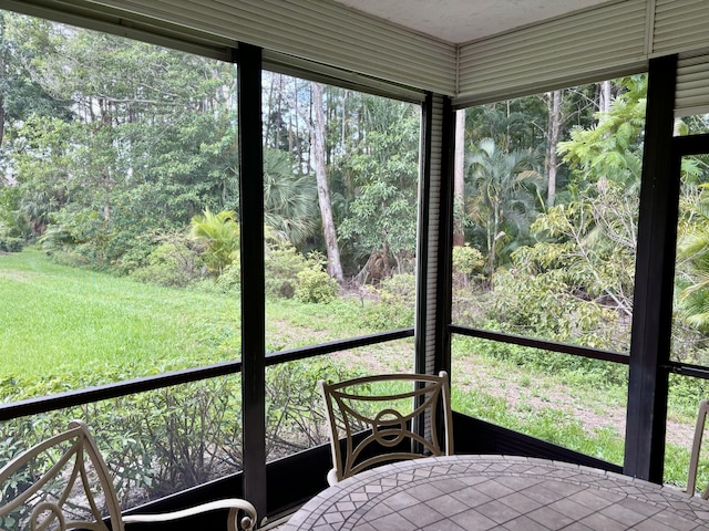 unfurnished sunroom featuring a healthy amount of sunlight