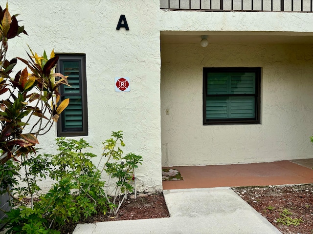 property entrance with a balcony