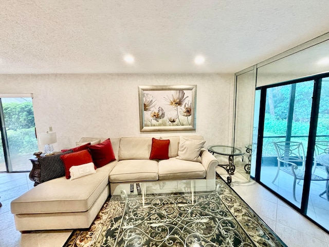 living room featuring plenty of natural light and a textured ceiling