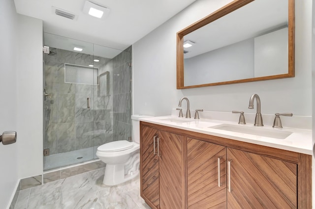 bathroom featuring toilet, vanity, and an enclosed shower