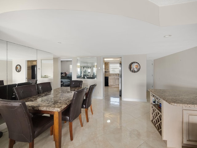 dining space with baseboards