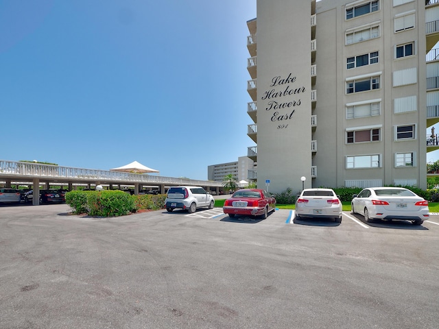 view of building exterior featuring uncovered parking