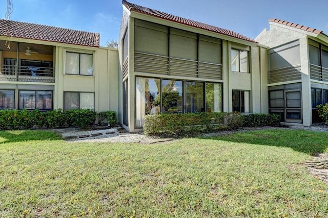 back of house featuring a yard