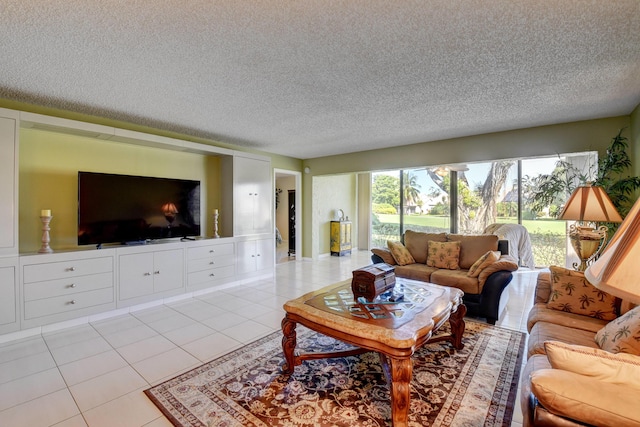 living room featuring light tile patterned floors and a textured ceiling