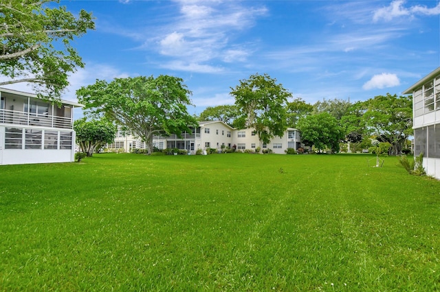 view of yard featuring a sunroom