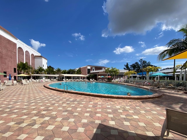 view of swimming pool with a patio area