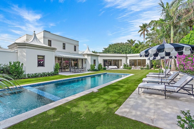 view of pool featuring a patio area and a lawn