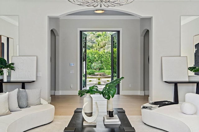 living room featuring crown molding and hardwood / wood-style flooring