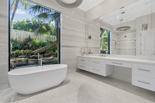 bathroom featuring vanity, shower with separate bathtub, and tile walls