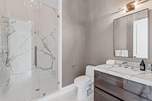 bathroom with walk in shower, large vanity, and toilet