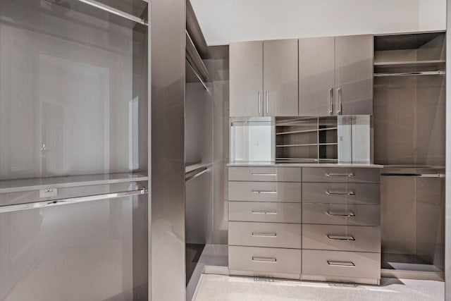 spacious closet with light tile flooring