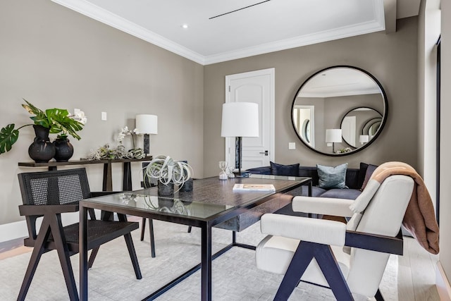 living room featuring ornamental molding and light hardwood / wood-style floors