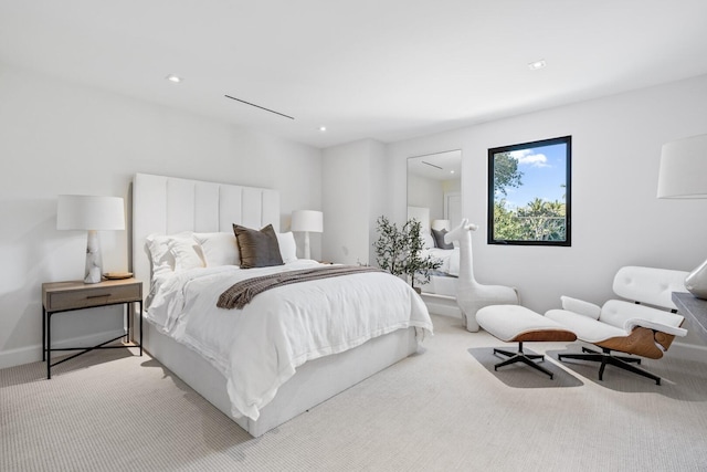 bedroom with light colored carpet