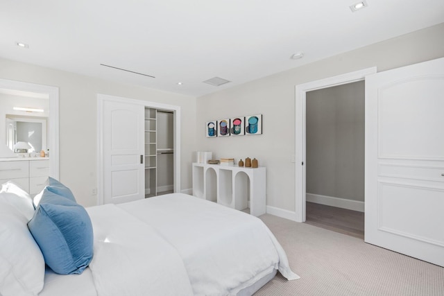 bedroom featuring light carpet