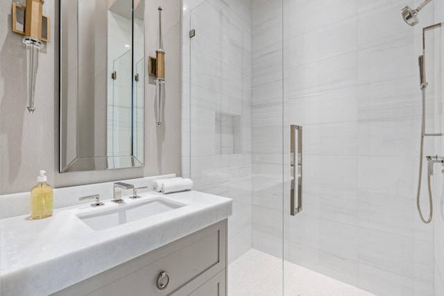 bathroom with vanity and a shower with shower door