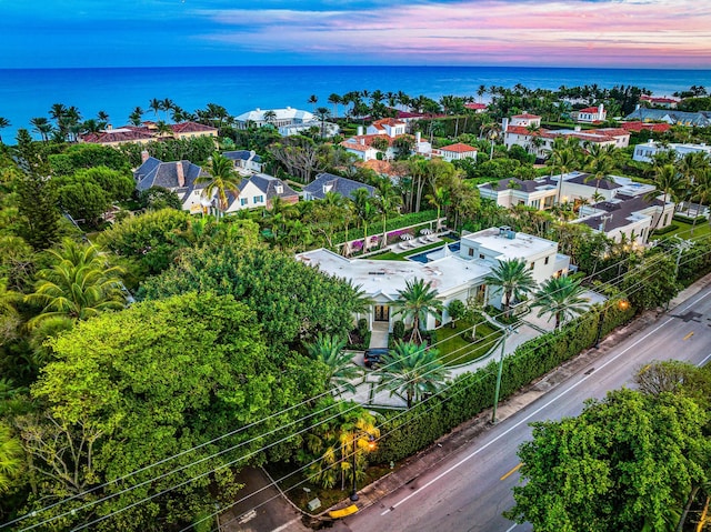 aerial view at dusk with a water view