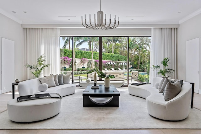 living room with a wealth of natural light, a notable chandelier, and ornamental molding