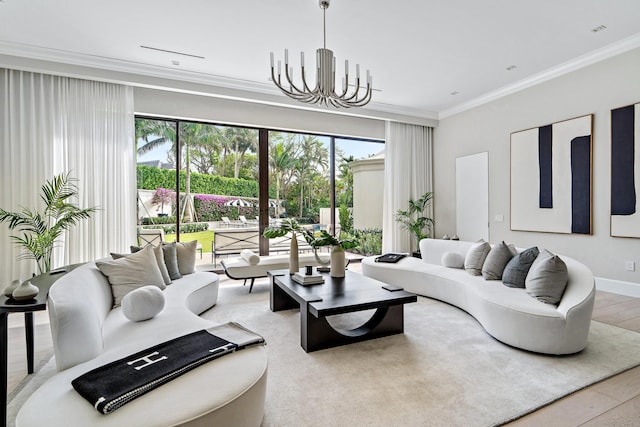 living room with hardwood / wood-style flooring, ornamental molding, and an inviting chandelier