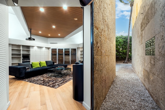 living room with hardwood / wood-style floors and wood ceiling