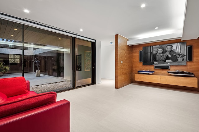 living room featuring floor to ceiling windows