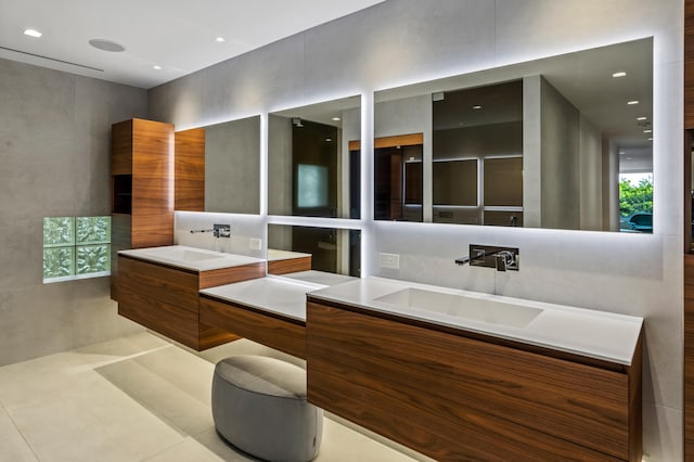 bathroom with vanity, tasteful backsplash, and tile patterned floors