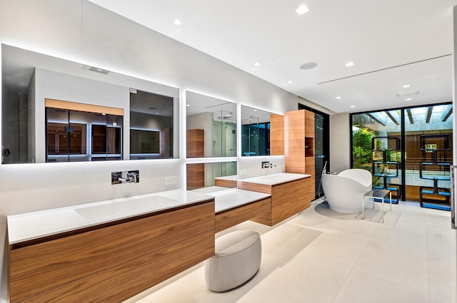 bathroom featuring vanity, a wall of windows, tile patterned floors, and independent shower and bath