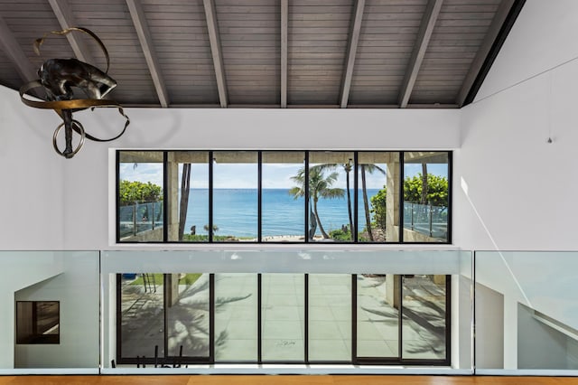 room details with wood ceiling, beamed ceiling, and a water view