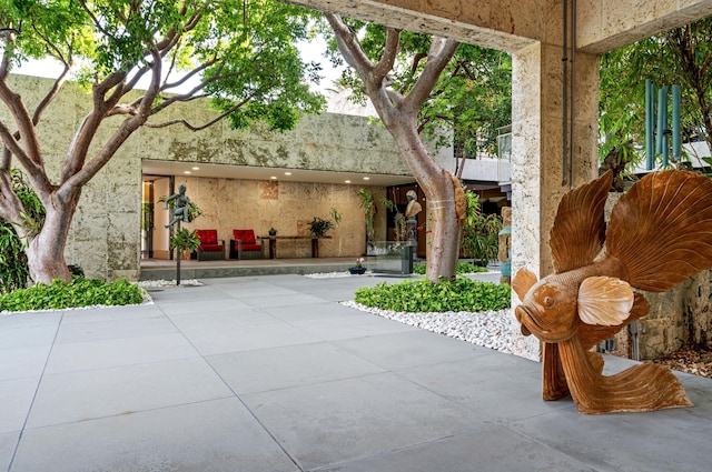 view of home's community featuring a patio area