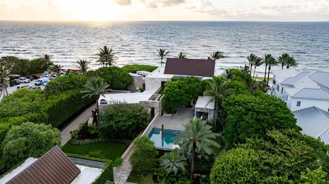 aerial view at dusk with a water view