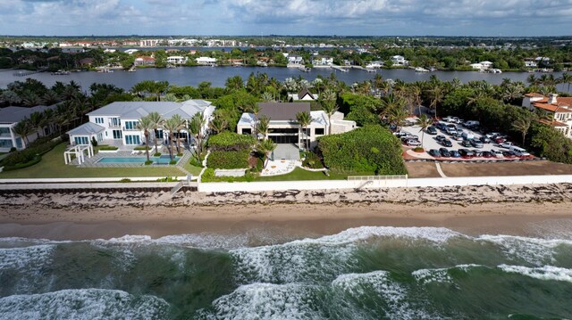 birds eye view of property featuring a water view and a view of the beach