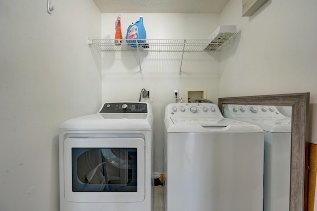 laundry room with washer and dryer