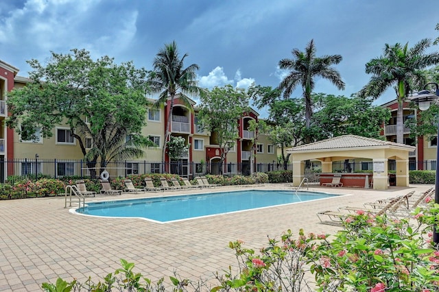 view of swimming pool featuring a patio area