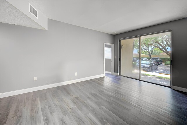 spare room with light hardwood / wood-style floors