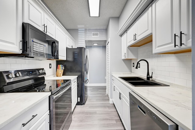 kitchen featuring white cabinetry, sink, and stainless steel appliances