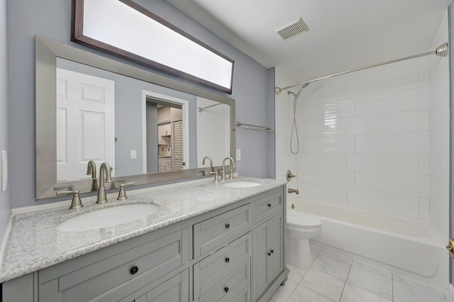 full bathroom with vanity, bathtub / shower combination, and toilet