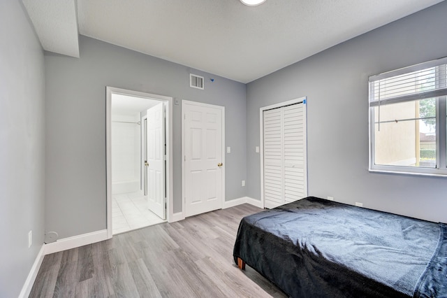 bedroom with light hardwood / wood-style flooring