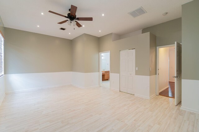 spare room featuring ceiling fan and light wood-type flooring